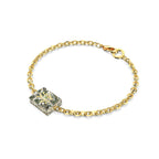 Angled view of gold-plated Shattered Dollar Mahjong bracelet with resin block